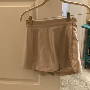 Kittenish beige skort. Size Extra small. Poly, rayon, spandex blend